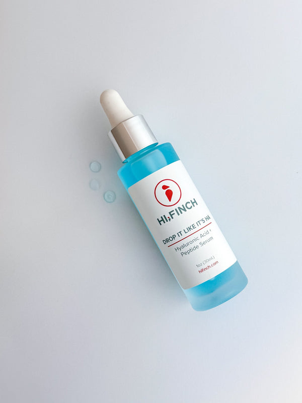 Hi Finch Drop It Like It’s HA Hyaluronic Acid + Peptide Serum bottle with dropper on white background, showing light blue serum and product label.